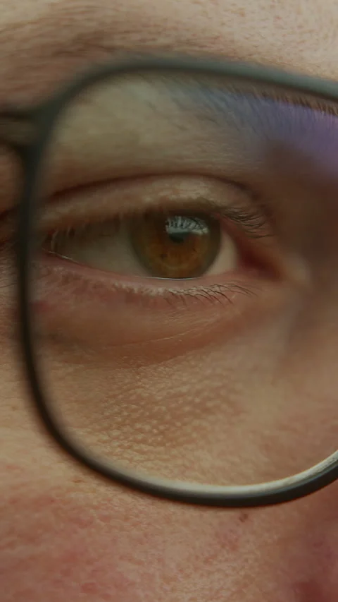 Vertical video. Intense extreme close-up of a Young Handsome Man with Glass.. Stock Footage 268876130