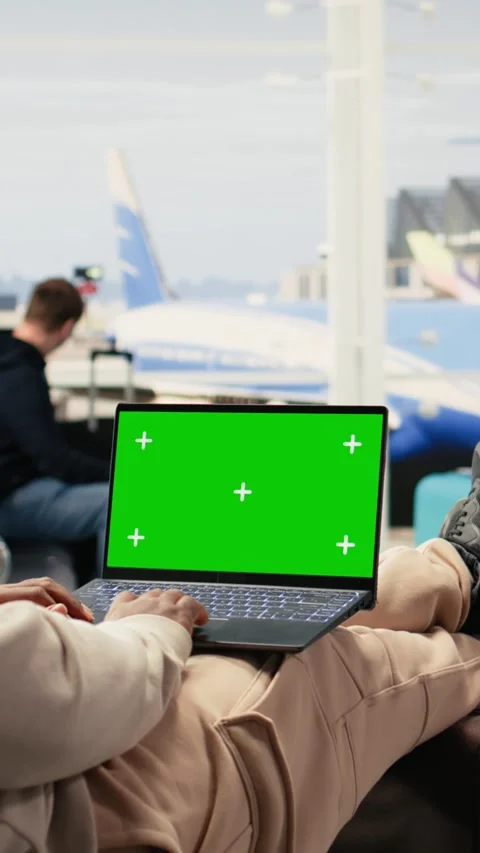 Vertical Video Isolated chroma key laptop with black man combining vacation and Stock Footage 333611999