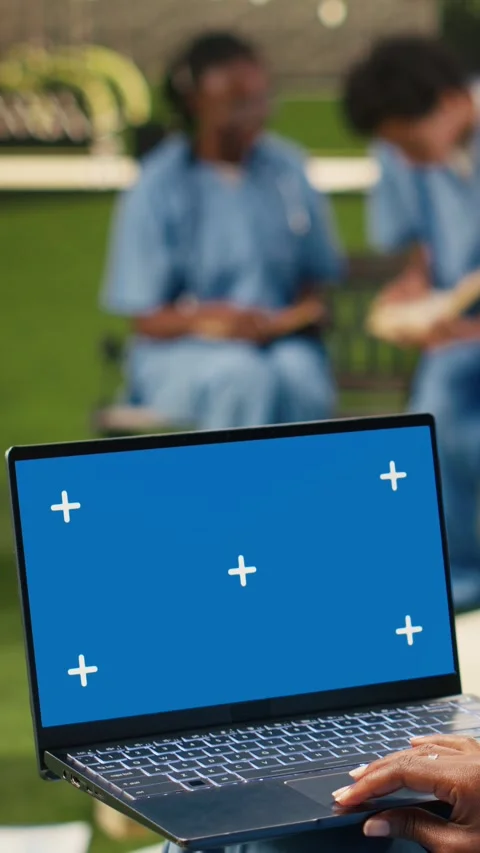 Vertical Video Isolated chroma key on laptop with blue screen on student lap Stock Footage 341321143