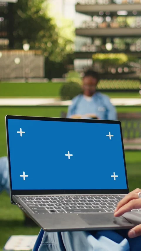 Vertical Video Isolated chroma key on laptop with blue screen on student lap Stock Footage 341321436