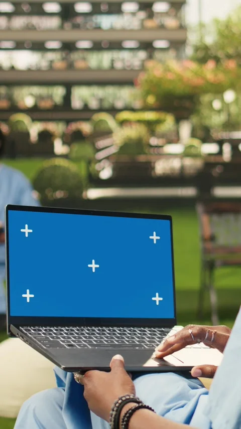 Vertical Video Isolated chroma key on laptop with blue screen on student lap Stock Footage 341321483