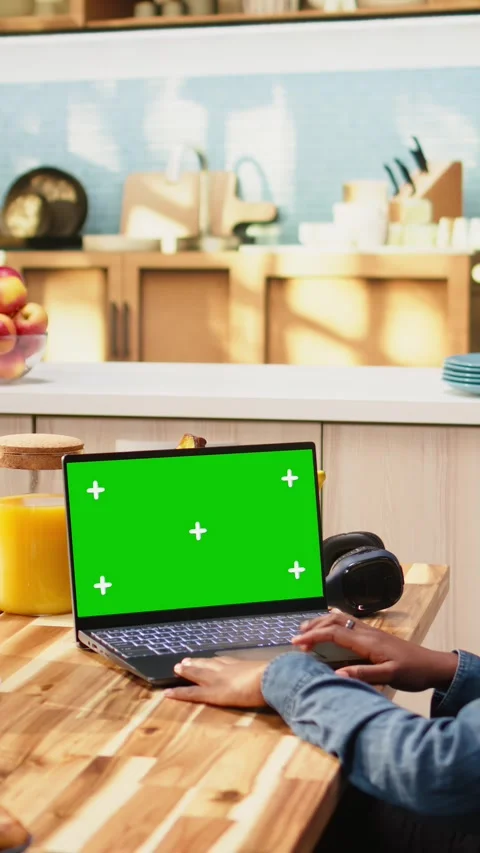 Vertical Video Isolated green screen on laptop mockup with woman at kitchen Stock Footage 344529888