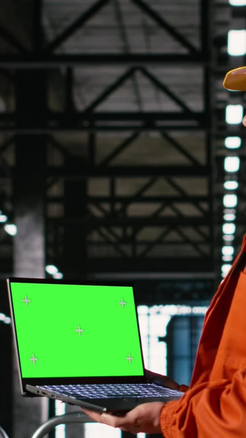 Vertical Video Isolated mockup on laptop with professional engineer in heavy Stock Footage 330085199