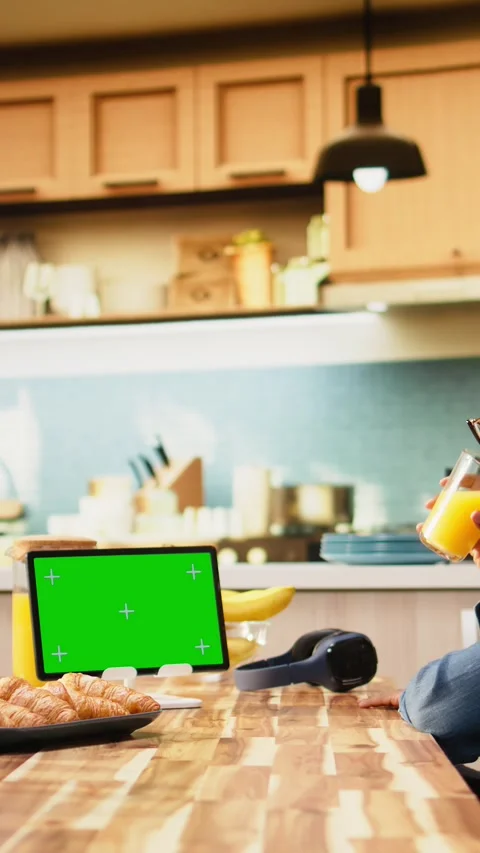 Vertical Video Isolated mockup screen on tablet screen in sunlit kitchen at Stock Footage 344529950