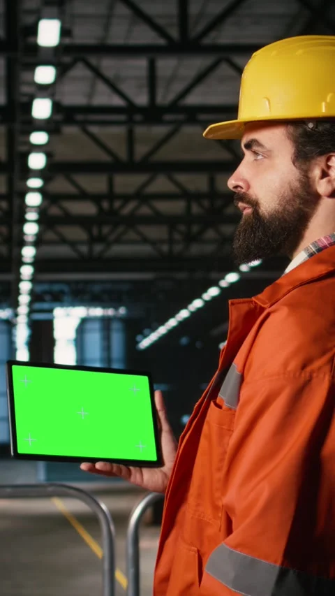 Vertical Video Isolated mockup on tablet held by engineer with helmet in Stock Footage 330085743