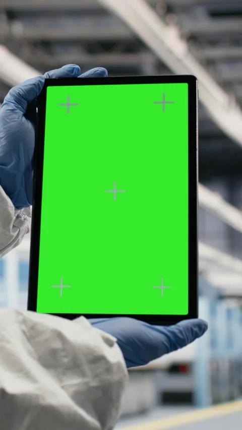 Vertical video Isolated screen tablet, testing silicon wafer batches and worker Stock Footage 333614731