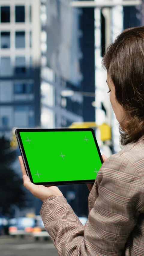 Vertical video Isolated screen tablet used by businesswoman in urban city Stock Footage 343560108