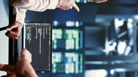 Vertical video IT developers writing server script code Stock Footage 246454434