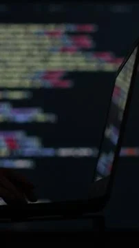 Vertical video. IT engineer, software developer, programmer interacts with a Stock Photos