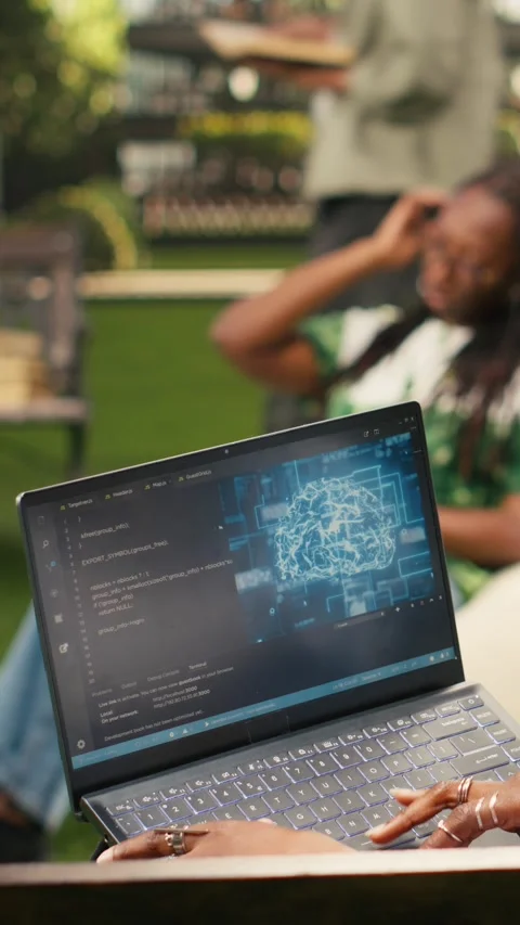 Vertical Video IT engineering student using AI and binary code on laptop screen Stock Footage 341321181