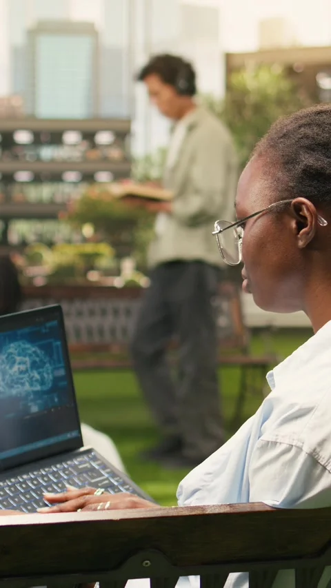 Vertical Video IT engineering student using AI and binary code on laptop screen Stock Footage 341321440