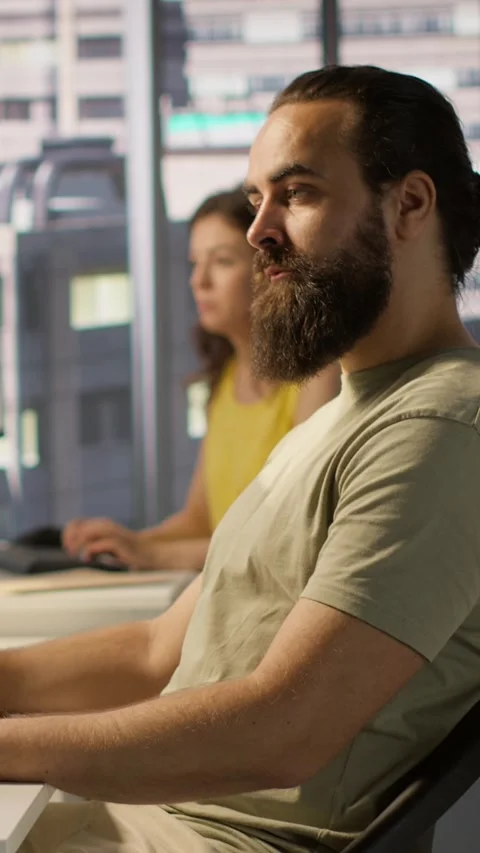 Vertical video IT expert in office focused on transforming data into predictive Stock Footage 319475613