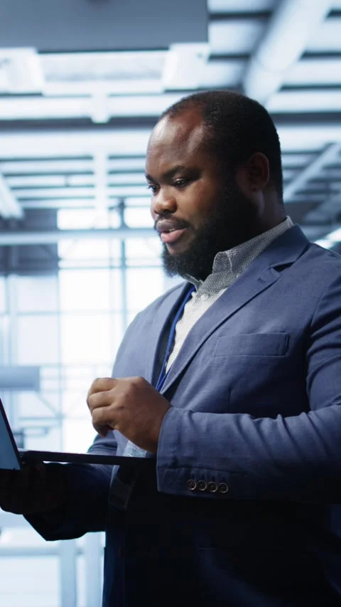 Vertical video IT professional in server room looking for network issues Stock Footage 277858796