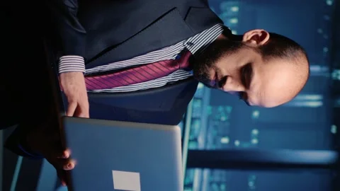 Vertical video: IT server engineer inspecting working computer processor Stock Footage 234018291