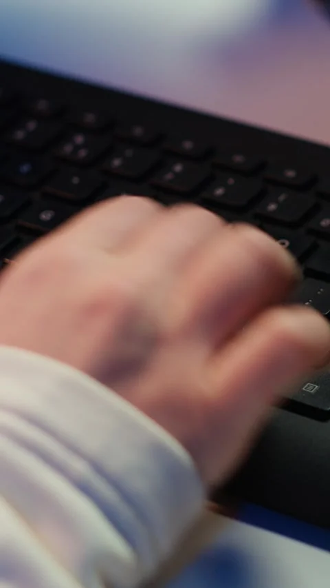 Vertical video IT specialist typing on PC keyboard, close up Stock Footage 283506964