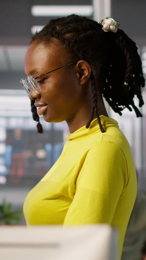 Vertical video IT staff member using laptop to do programming in office Stock Footage 319489064