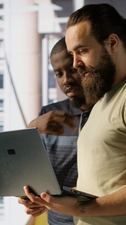 Vertical video IT staff members in office analyzing and interpreting complex Stock Footage 319484318