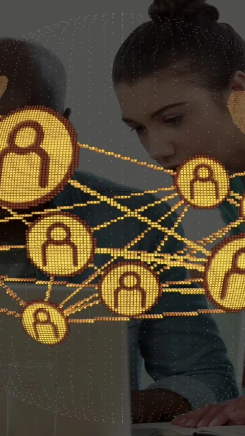 Vertical video: IT team leaning toward laptop in office sparking golden node Stock Footage 331271109