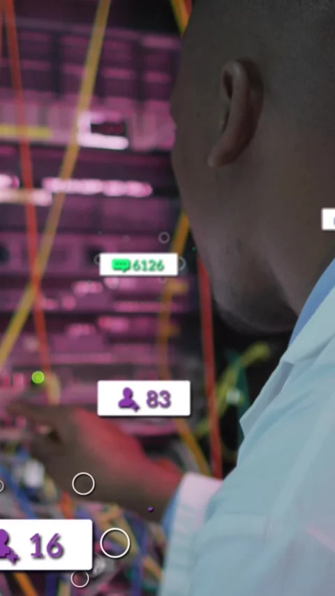 Vertical video: IT tech reacting to rising user icons and green counters, fixing Stock Footage 331738794