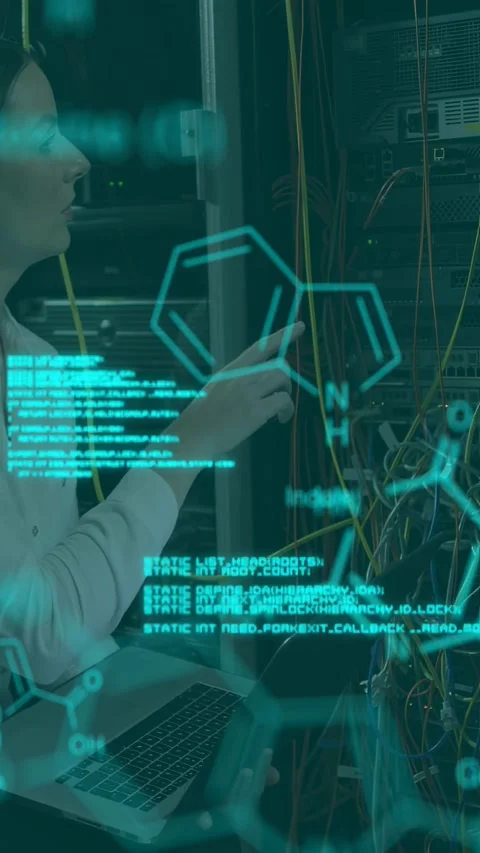 Vertical video: IT tech typing laptop and routing yellow cable at rack for Stock Footage 340133478