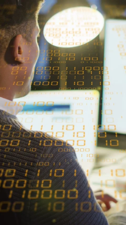 Vertical video: ITpro seeing screen leaning typing analyzing data binary overlay Stock Footage 334694944