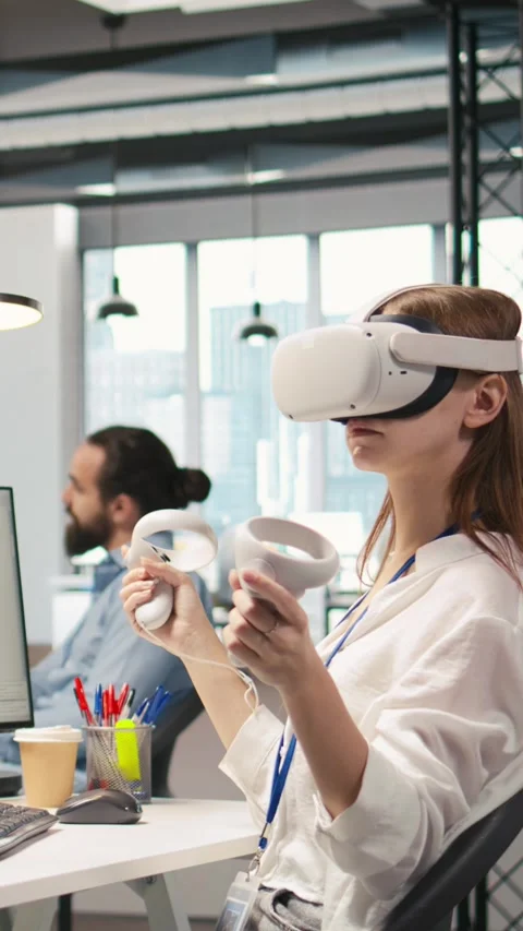 Vertical video Junior dev using virtual reality at work, testing generative AI Stock Footage 312708746