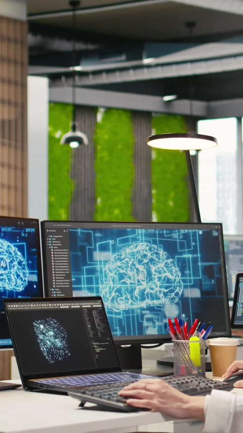 Vertical video Junior developer in office streamline workflows using AI systems Stock Footage 312709309