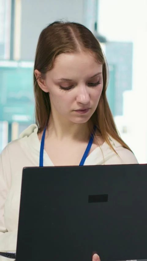 Vertical video Junior developer utilizing artificial intelligence to optimize Stock Footage 312709408