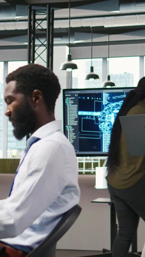 Vertical video Junior developer utilizing artificial intelligence to optimize Stock Footage 312709434