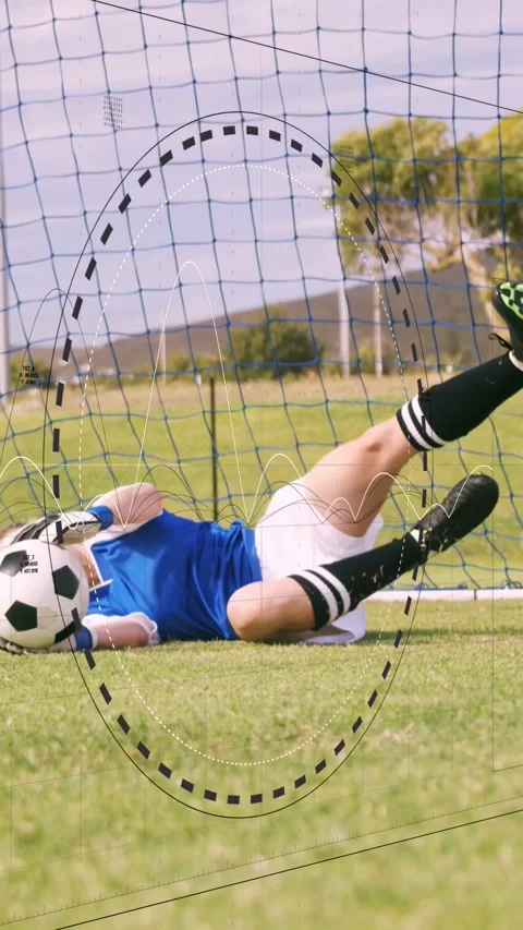 Vertical video: Keeper on incoming ball diving to hold ball on sports pitch Stock Footage 340133601