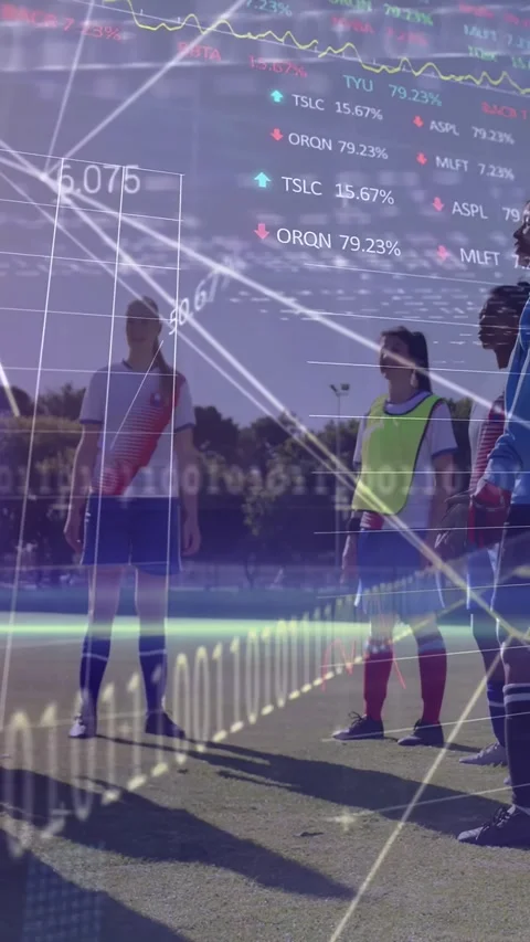 Vertical video: Kick sending ball up, women team tracking flight on pitch, Stock-Footage 330195969