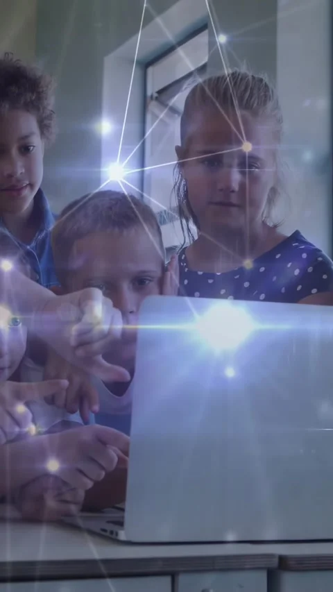 Vertical video: Kids crowding silver laptop after tap, network overlay aiding Stock Footage 331270917