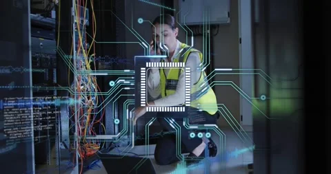 Vertical video: Kneeling tech in hi-vis taking call while testing rack on laptop Stock Footage 334115596