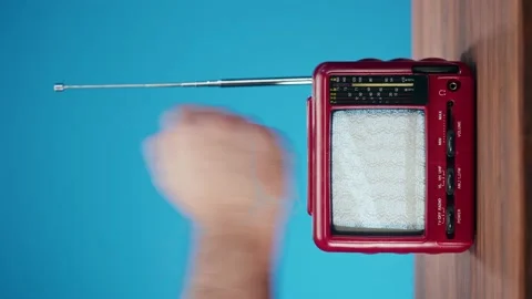 Vertical video of knocking on small old television with grey interference screen Stock Footage 169733519