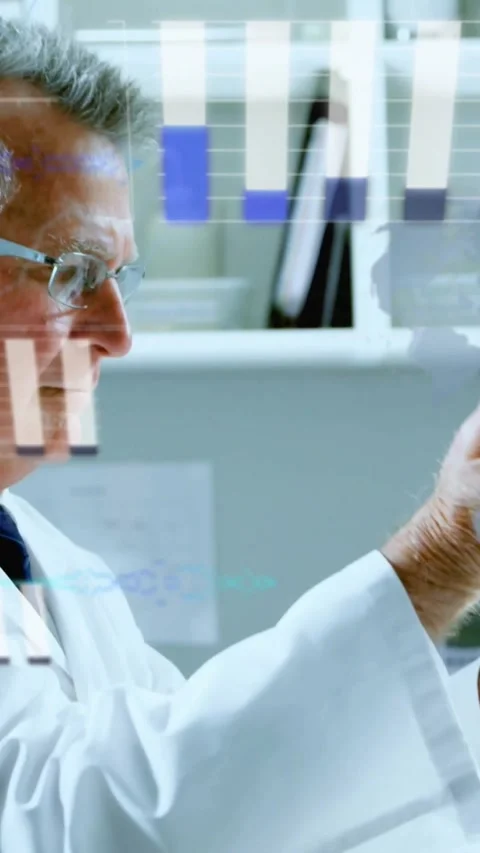 Vertical video: Lab lead reaching syringe, measuring yellow fluid while data Stock Footage 331790326