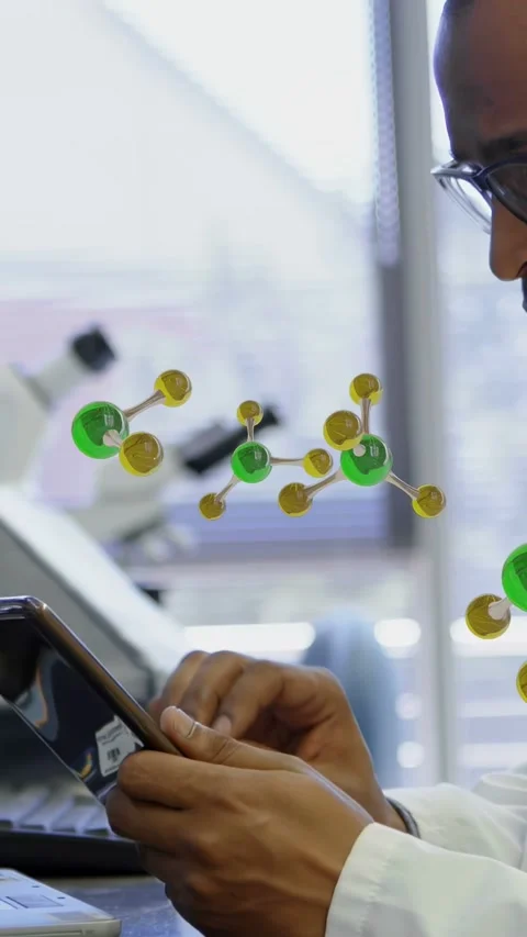 Vertical video: Lab scientist tapping tablet, causing molecules floating near Stock Footage 335264214