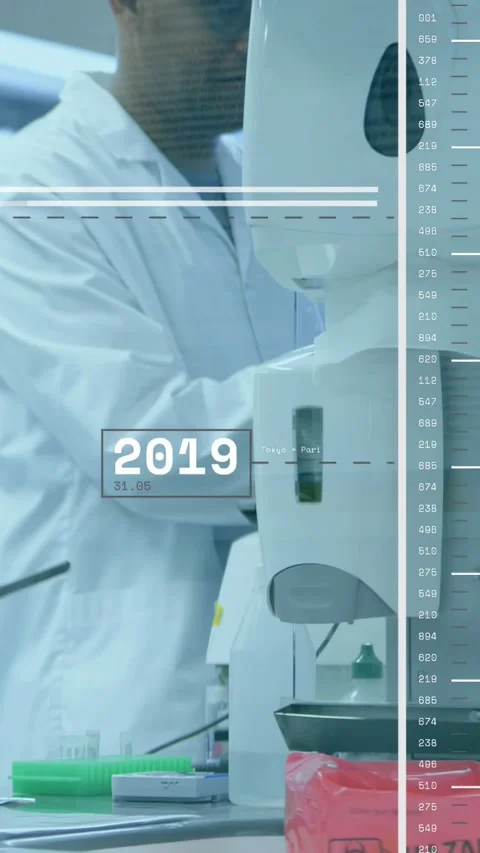 Vertical video: Lab tech adjusting analyzer as timeline cycling, hand placing Stock Footage 330542892