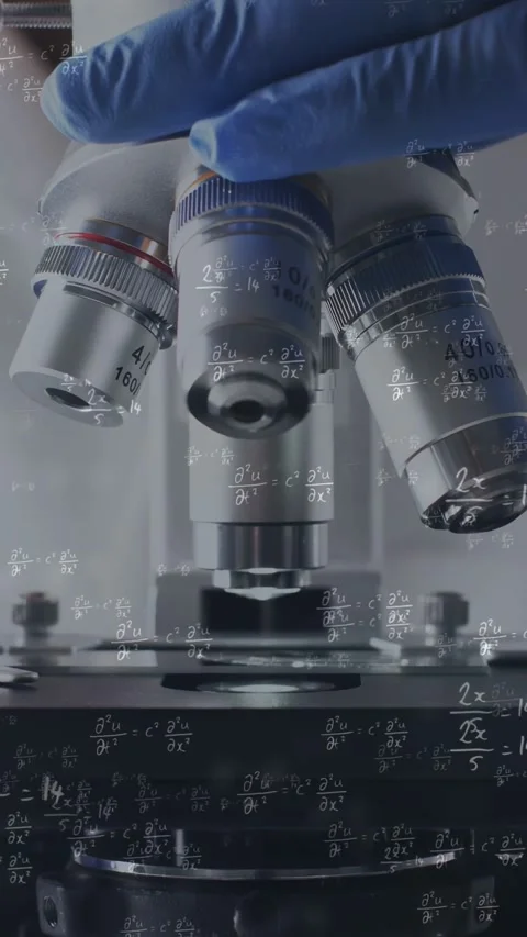 Vertical video: Lab tech hand touching turret, rotating lens over stage, math Stock Footage 335264177