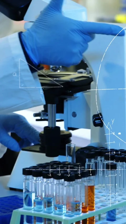 Vertical video: Lab tech lowering orange tube into vortex mixer, turning speed, Stock Footage 330430397