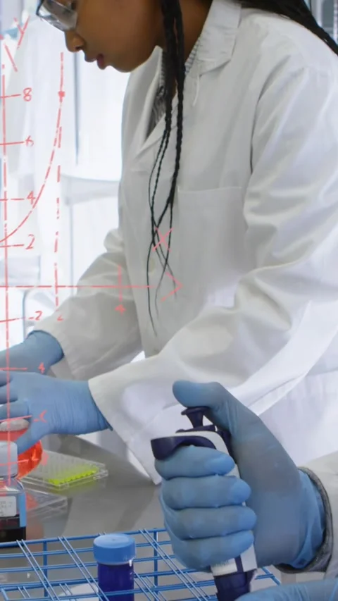 Vertical video: Lab tech pressing pipette plunger, coworker steadying tubes, Stock Footage 330580698