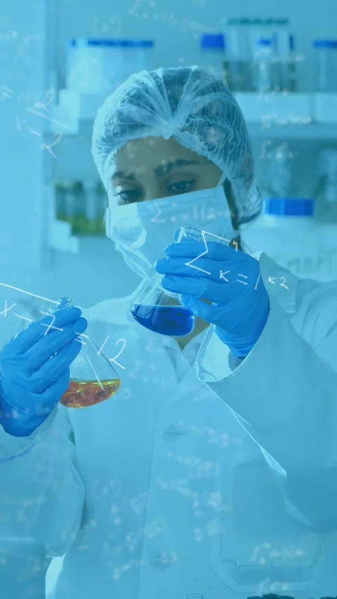 Vertical video: Lab tech raising blue flask comparing liquids color clarity with Stock Footage 330542870