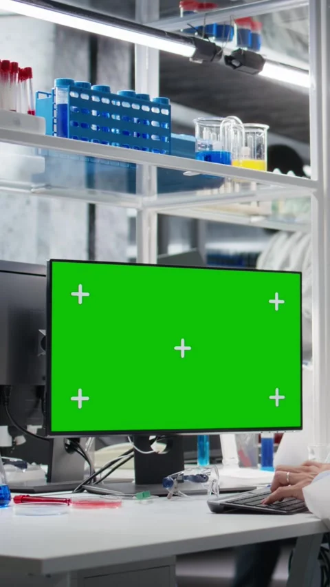 Vertical video Lab technician using green screen computer for DNA data analysis Stock Footage 319505233