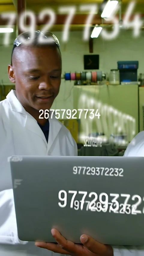 Vertical video: Lab techs bringing laptop into frame, checking data, numbers Stock Footage 334917188