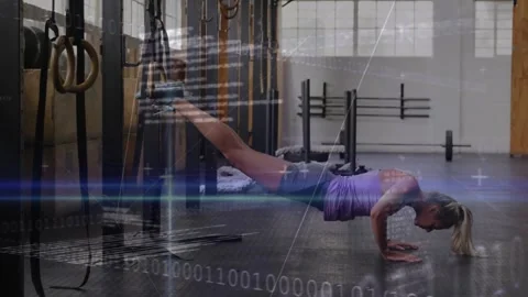 Vertical video: Lady doing decline pushups, ankle straps on rig in gym, purple Vídeos de archivo 330718331