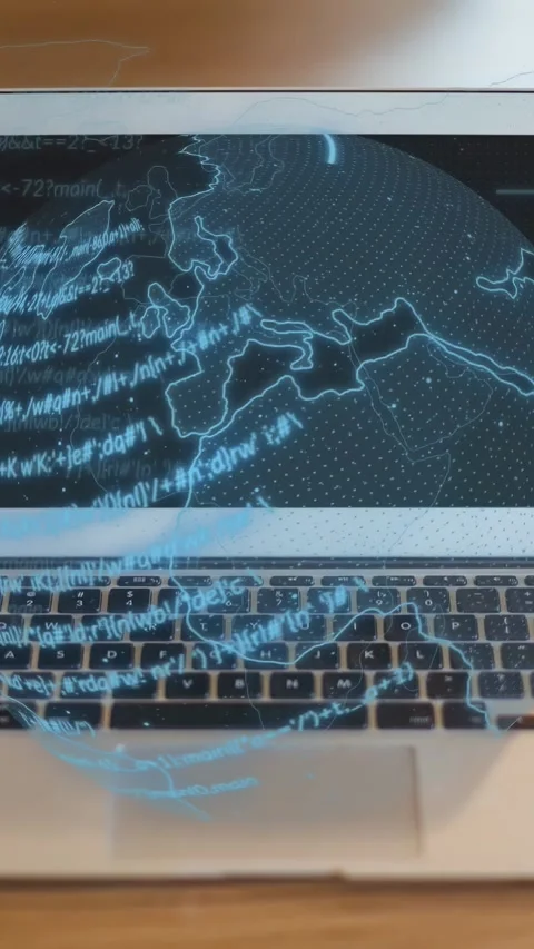 Vertical video: Laptop booting, showing holo globe and code wrapping onto Stock Footage 332335227