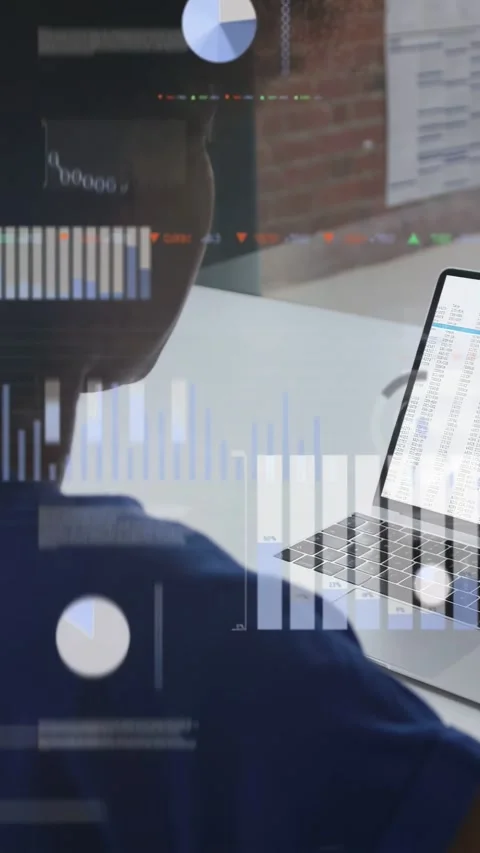 Vertical video: Laptop spreadsheet loading activating charts woman scanning Stock Footage 332985345