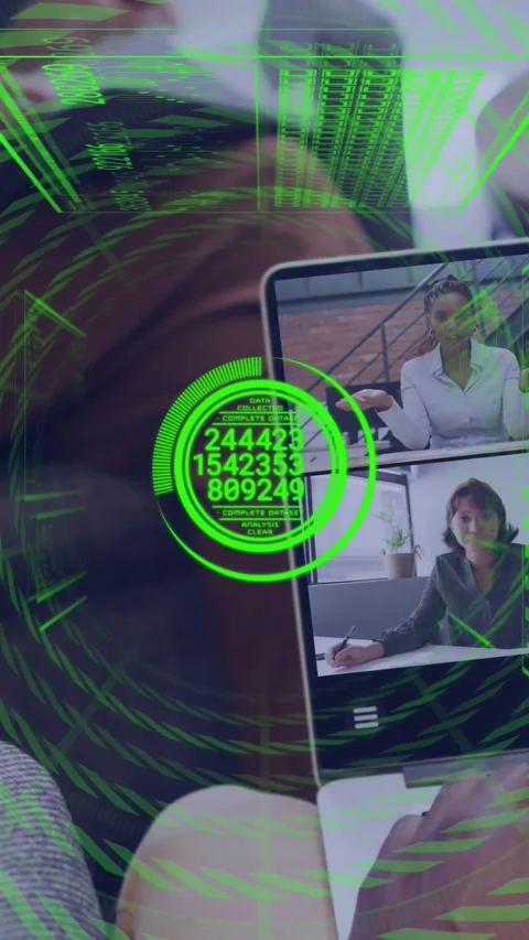 Vertical video: Laptop user typing, causing green HUD, rings rotating and data Video stock 329756398