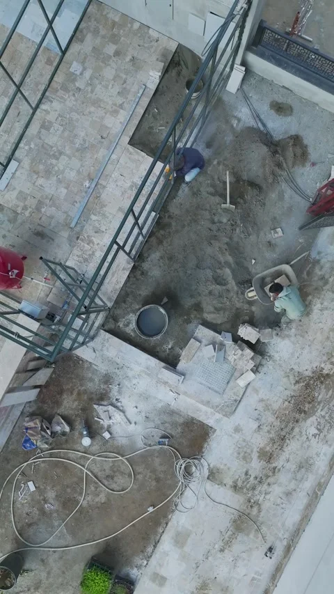 Vertical Video: Large Construction Site With Ground Preparation and Welding by 库存影片 344316767