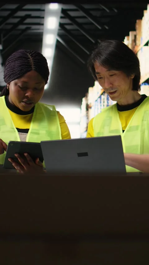 Vertical Video Large scale warehouse team manages e-commerce order processing Stock Footage 312651236