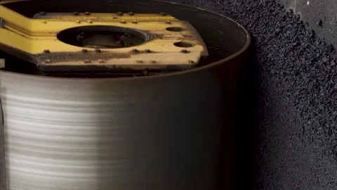 Vertical video A large yellow steamroller flatten hot asphalt. Builds a new road Video stock 151992214